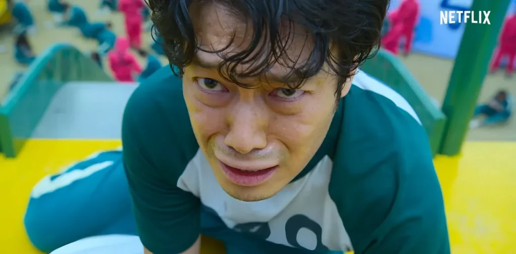 Lee Jung-jae crying face on slide in Squid Game thriller